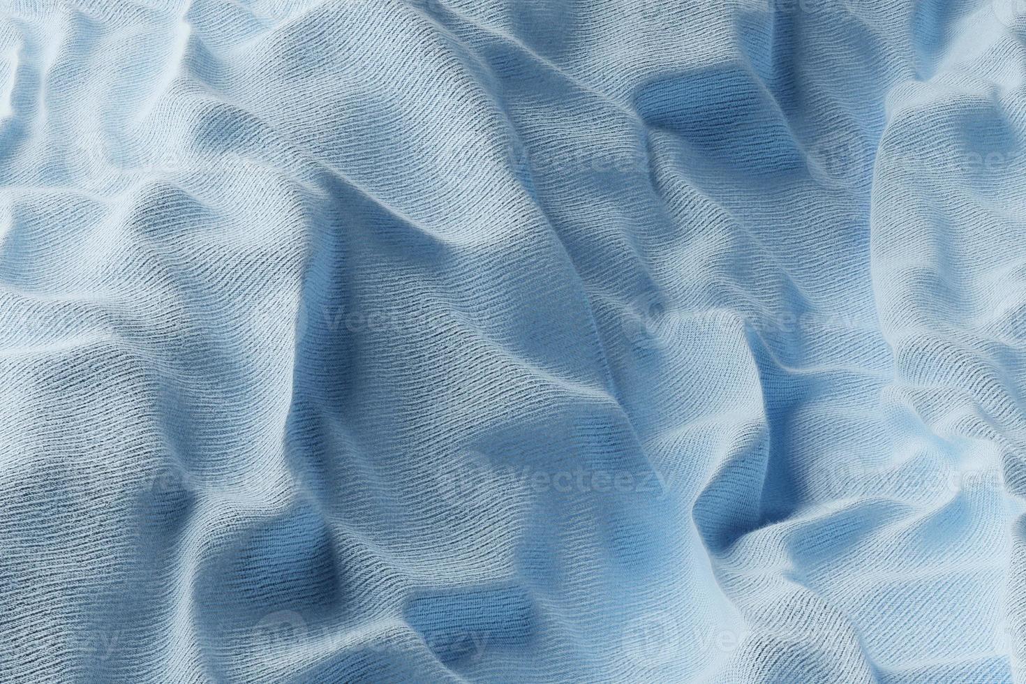 Folds of  blue  fabric. Texture. photo