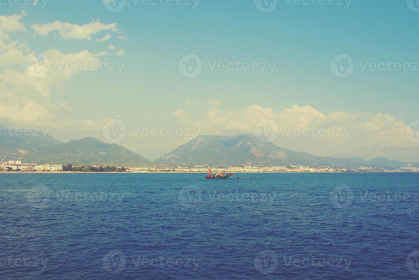 original landscape of the port and city of Alanya in Turkey from the sea photo