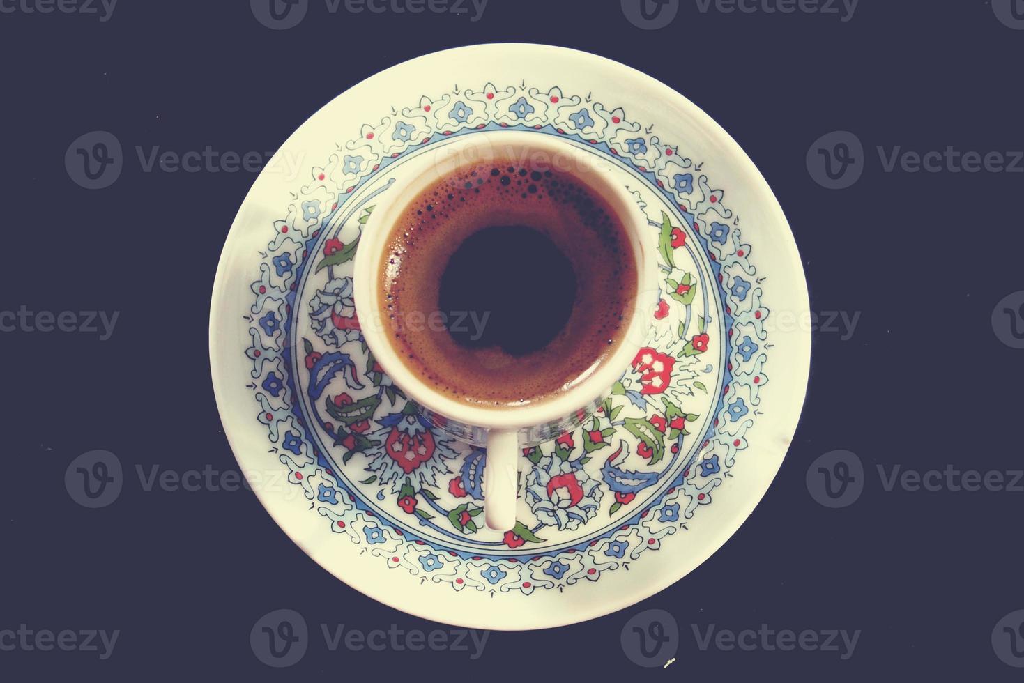 tasty hot original Turkish coffee served in a small charming cup photo