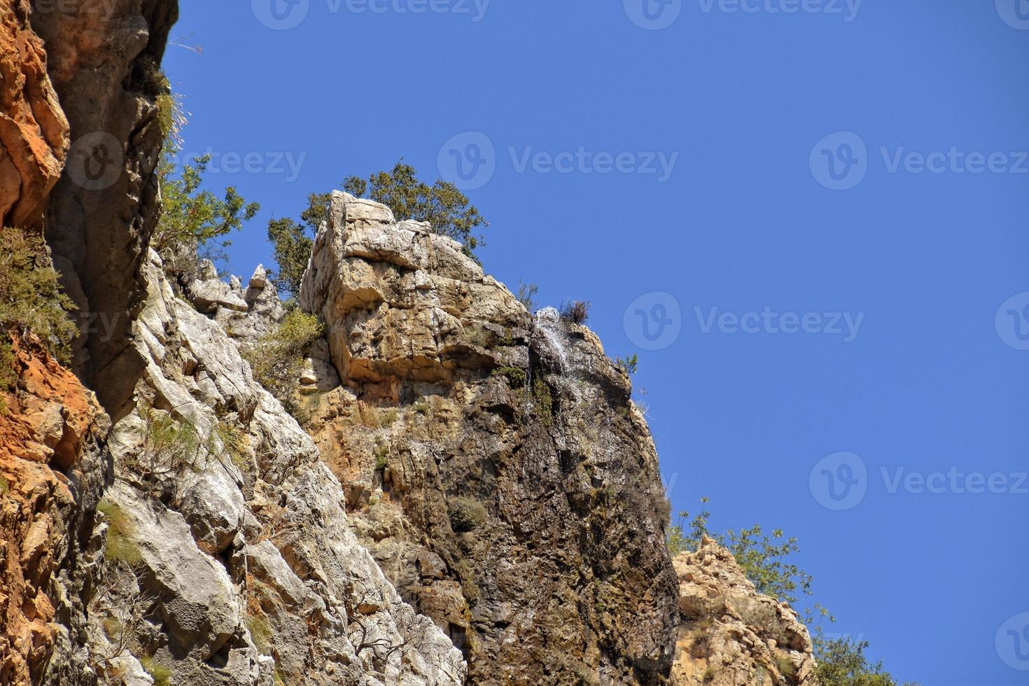 a natural wild landscape in the Turkish mountains with an interesting waterfall and the sapadere canyon photo