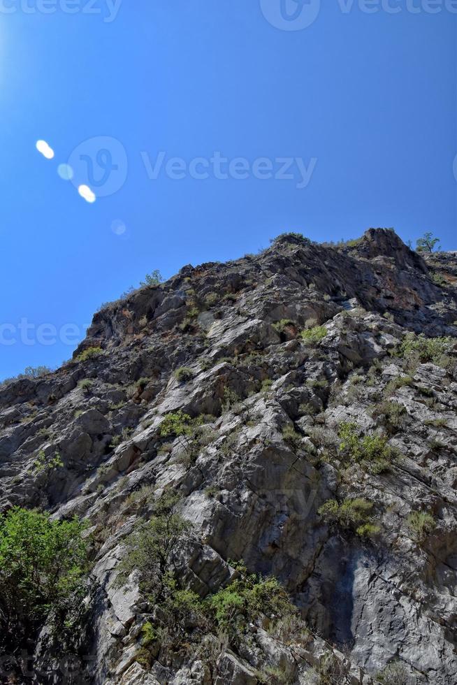 a natural wild landscape in the Turkish mountains with an interesting waterfall and the sapadere canyon photo