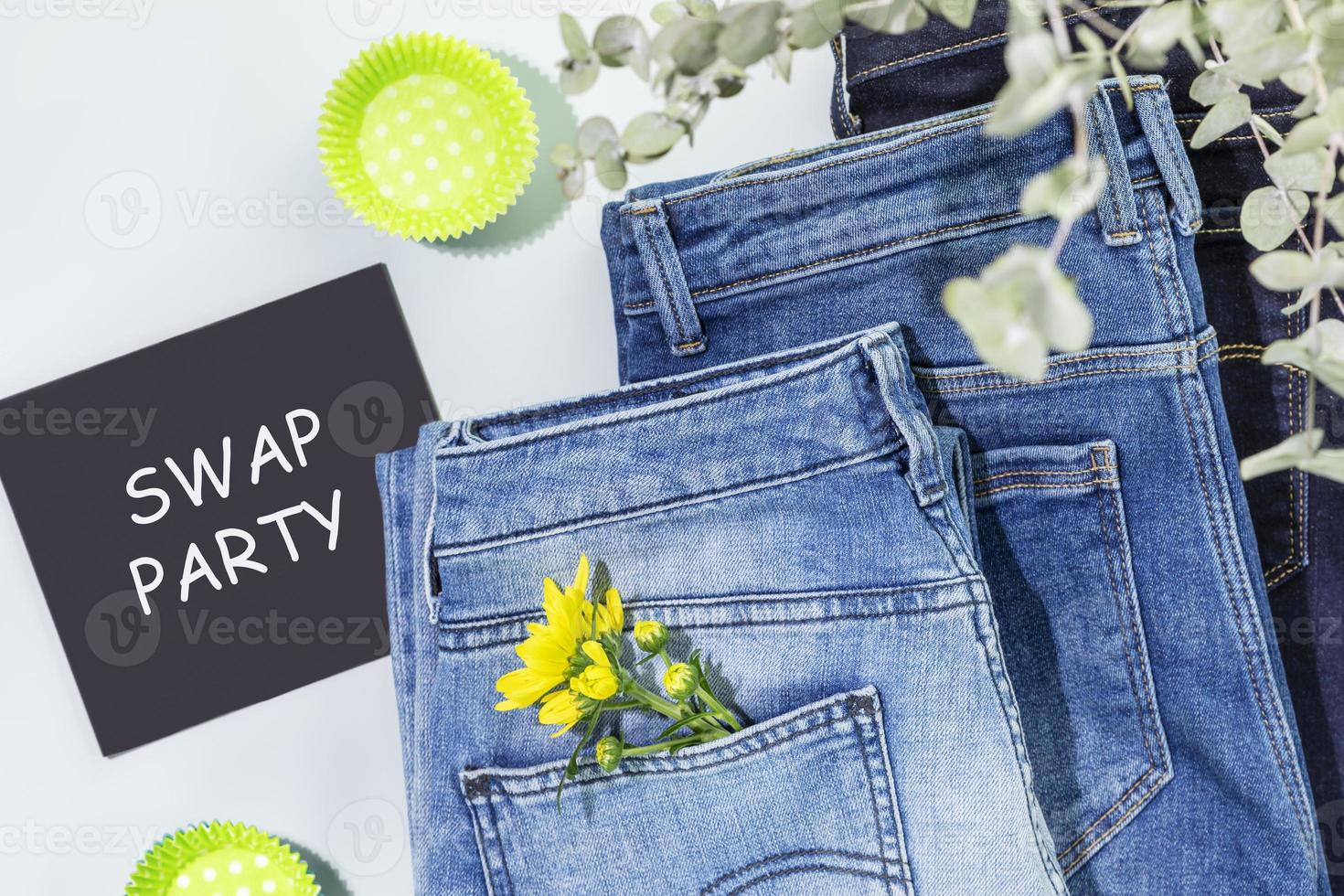 Jeans with flowers and blackboard with inscription Swap Party photo