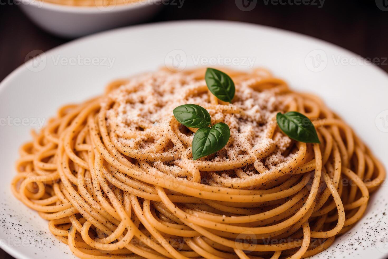 Spaghetti pasta with parmesan cheese and parsley on a plate. photo