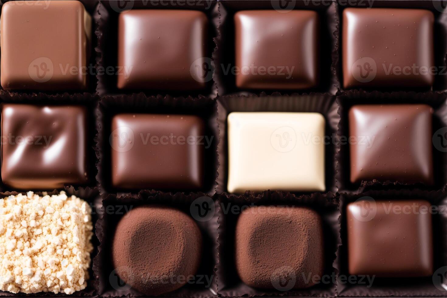An assortment of chocolate, candy, bars and chocolate pieces on a wooden background, sweet food. Chocolate cake. photo