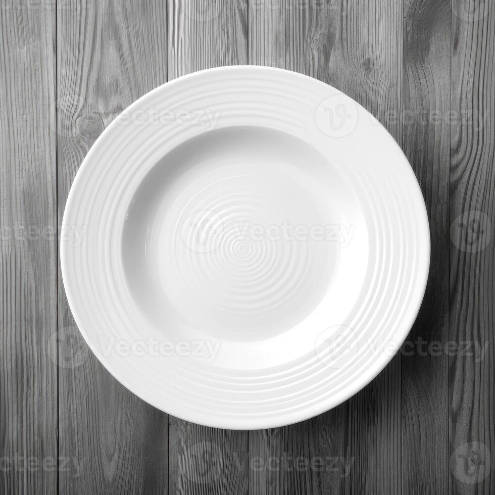 An empty plate on a white wooden table. Top view of white ceramic plate on white wooden. . photo