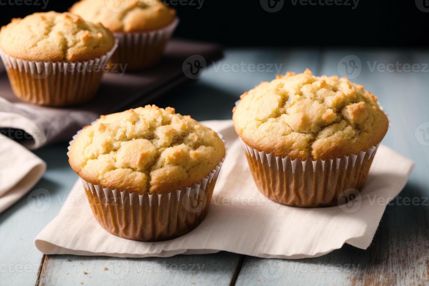 Homemade muffins with cinnamon and almonds on a black background. photo