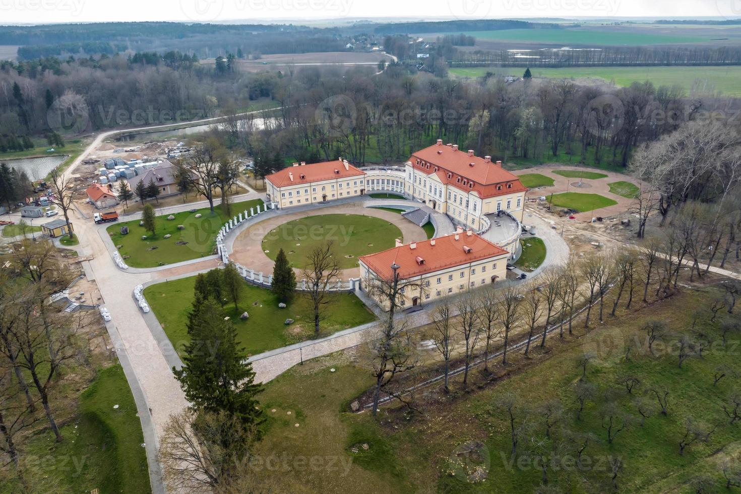 aerial view on overlooking restoration of the historic castle or palace near lake photo