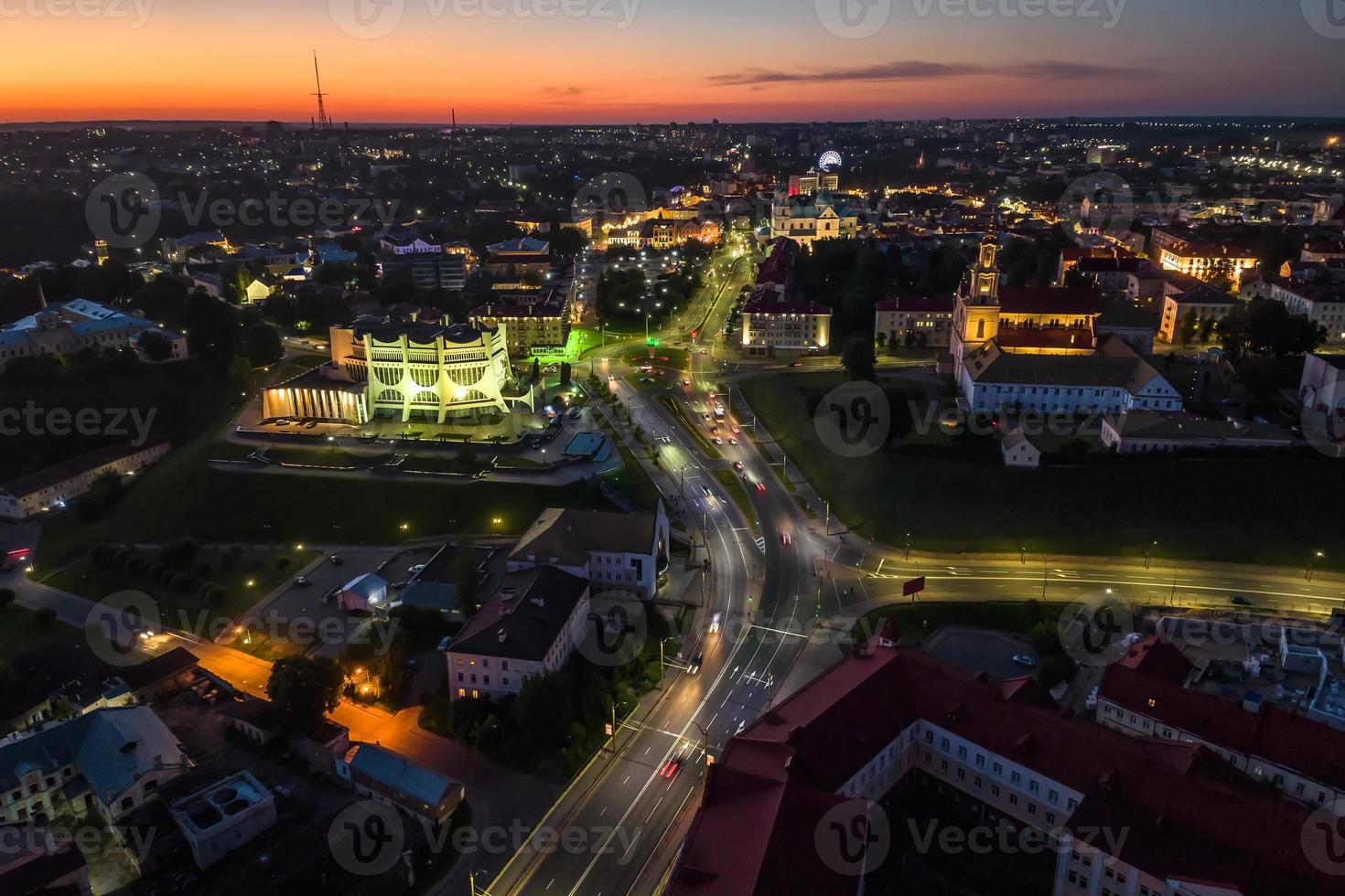 Night over road with cars with headlights on highway. night life in big city. looking down on traffic photo