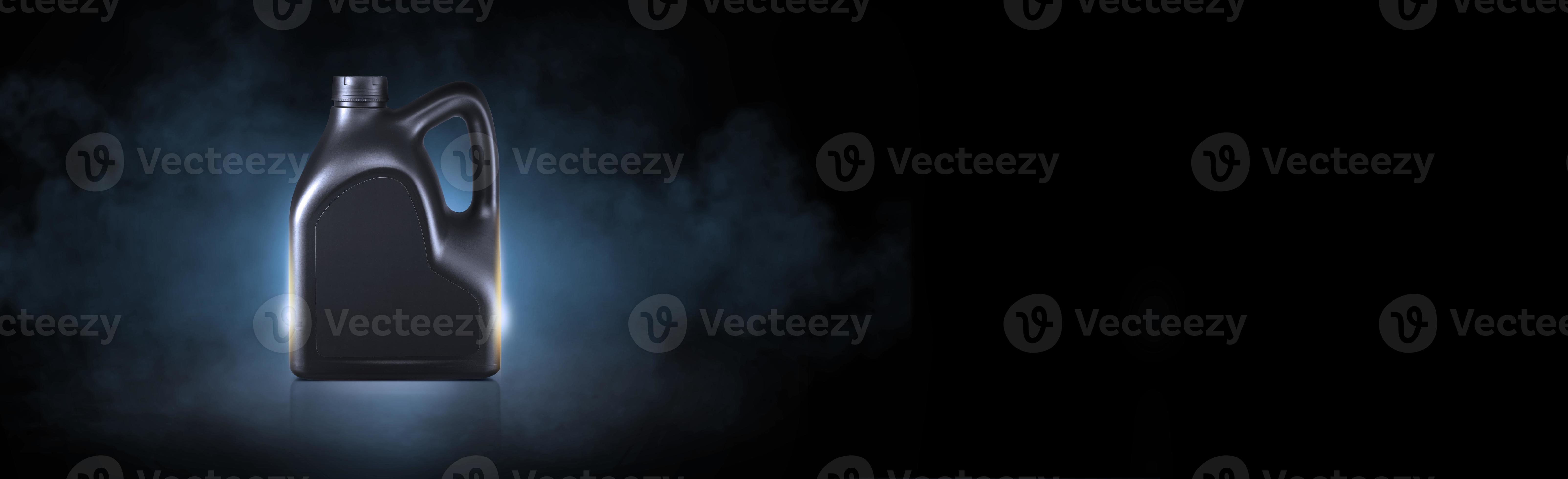 Black bottle of engine oil on black background with smoke 22915535