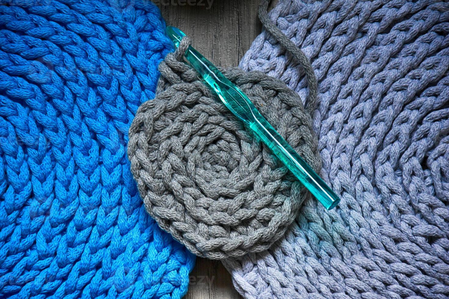 grey handmade cottoncord tablecloths on crochet hook photo