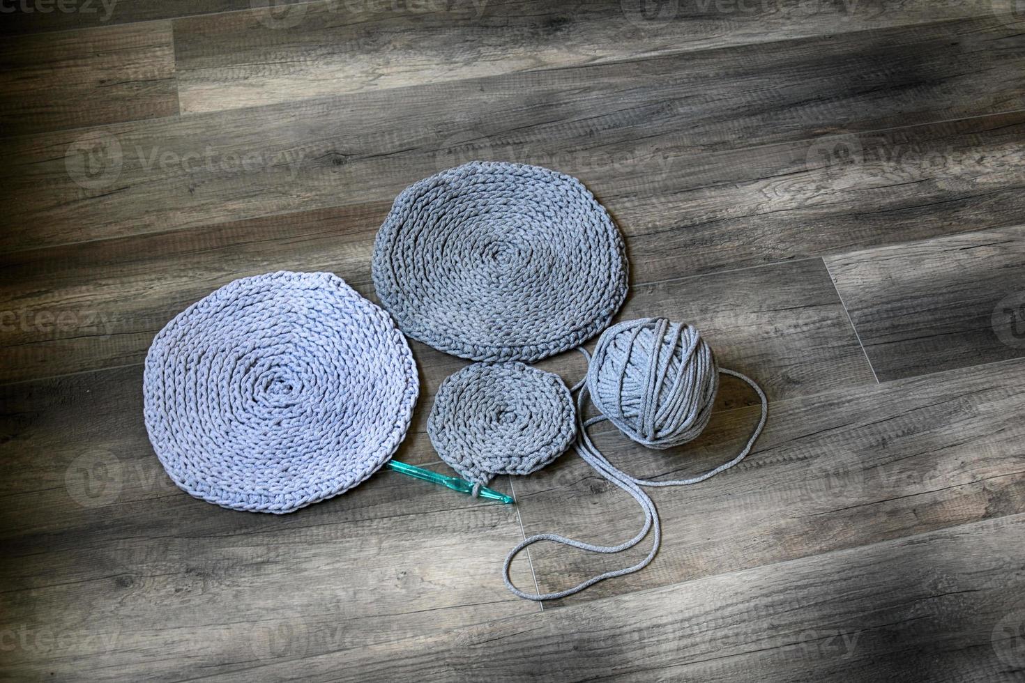 grey handmade cottoncord tablecloths on crochet hook photo