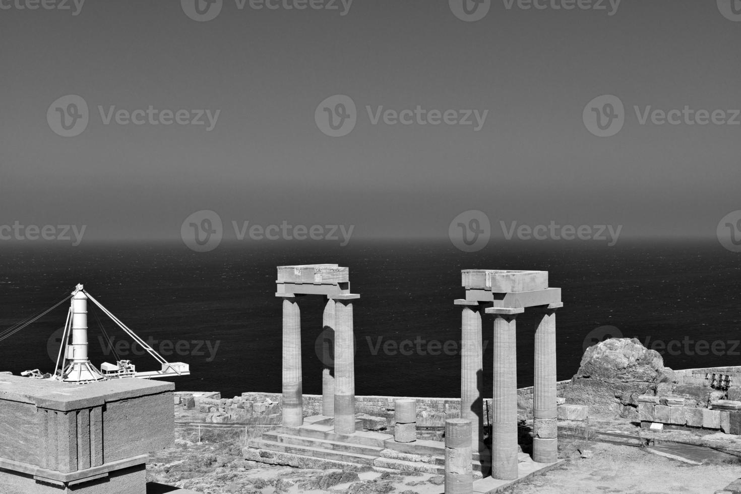 old antique stone ruins on a hot summer day on the Greek island of Rhodes in Lindos photo