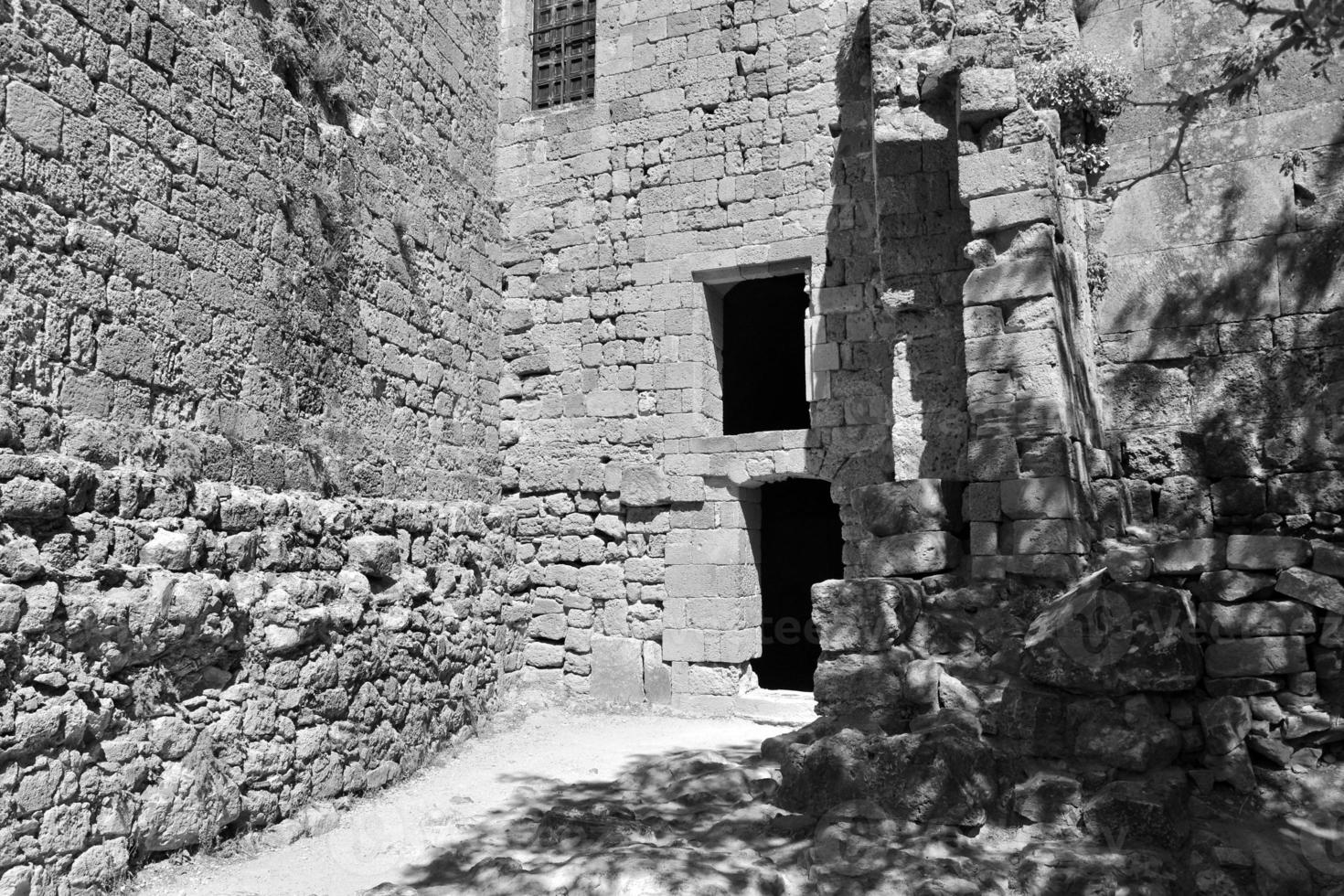 old antique stone ruins on a hot summer day on the Greek island of Rhodes in Lindos photo