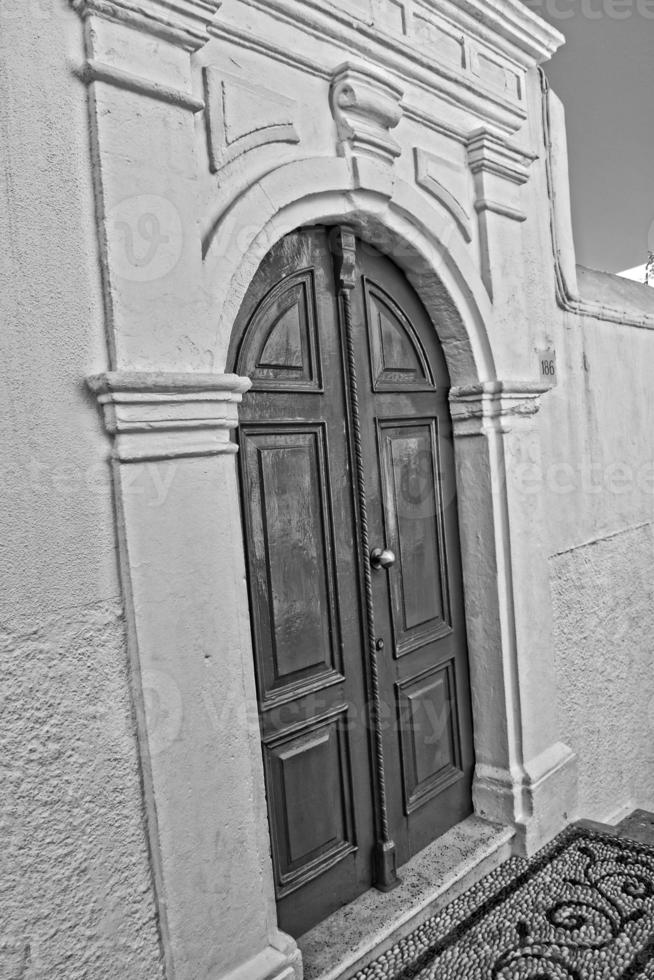 wooden door in the historic greek town of Lindos in Greece on a holiday day photo