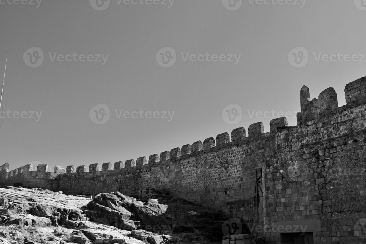 old antique stone ruins on a hot summer day on the Greek island of Rhodes in Lindos photo