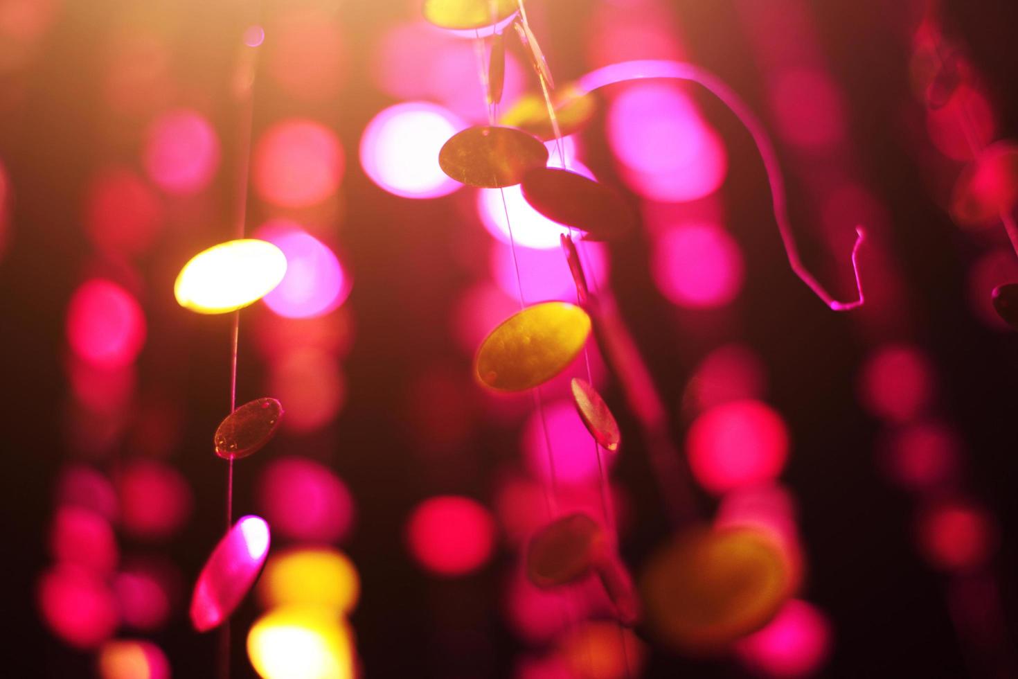 Glamour Ultra Violet sparkling and purple glitter bokeh of metallic circle. Multicolored Christmas and New Year glowing light abstract for Christmas and holiday concept. photo