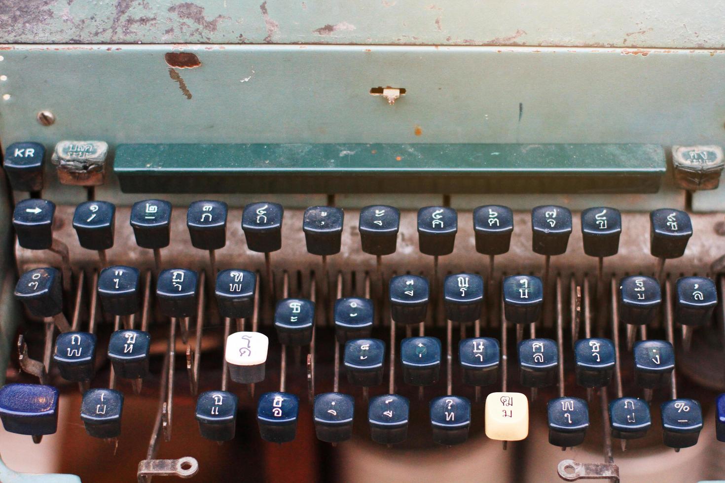 Vintage rustic Thai alphabet typewriter in Antique store photo