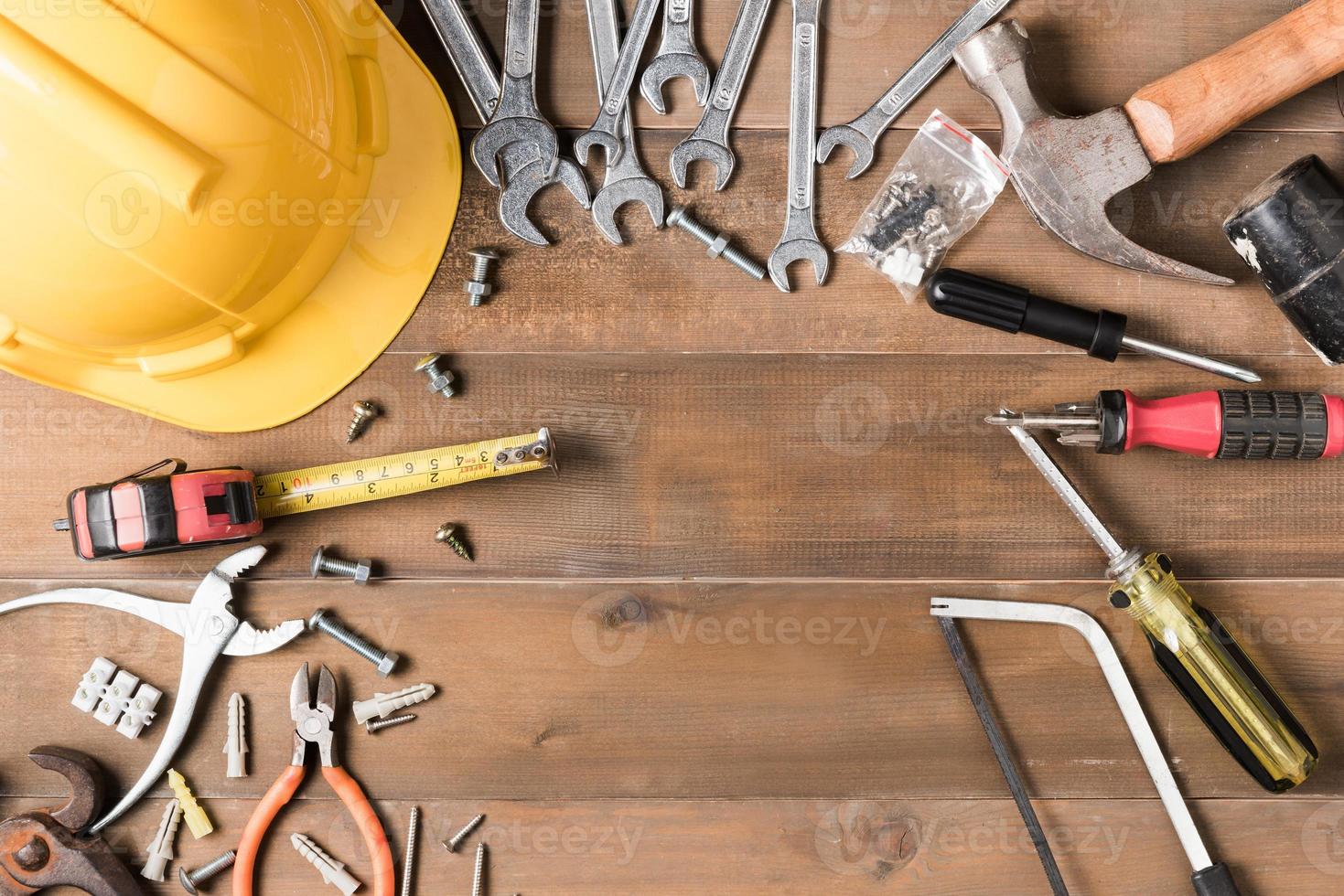 set of tools supplies on wood background photo