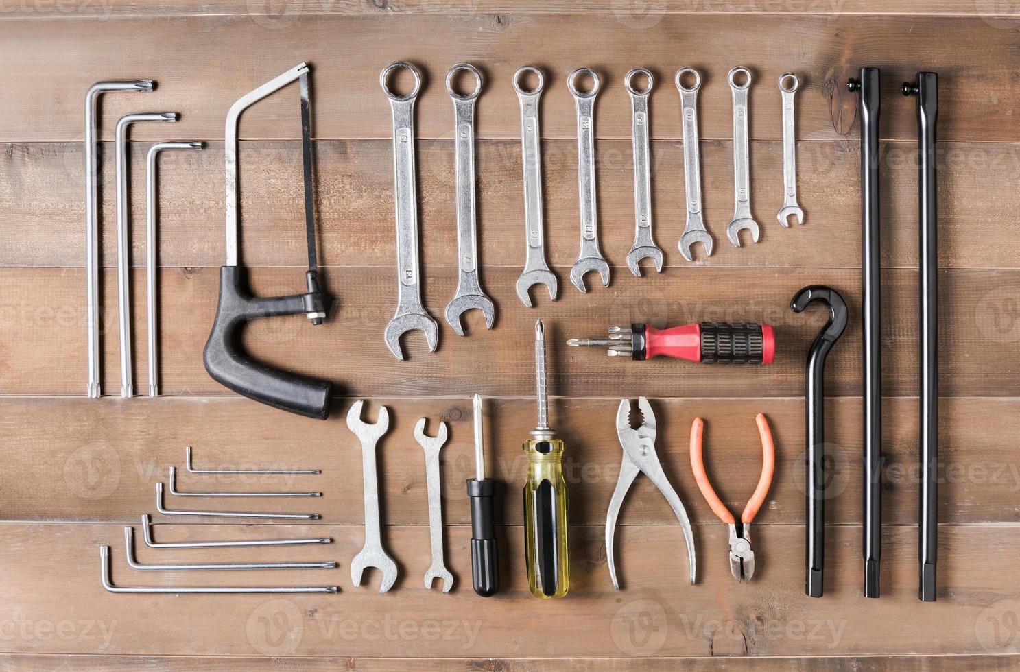 set of tools supplies  on wood background top view photo