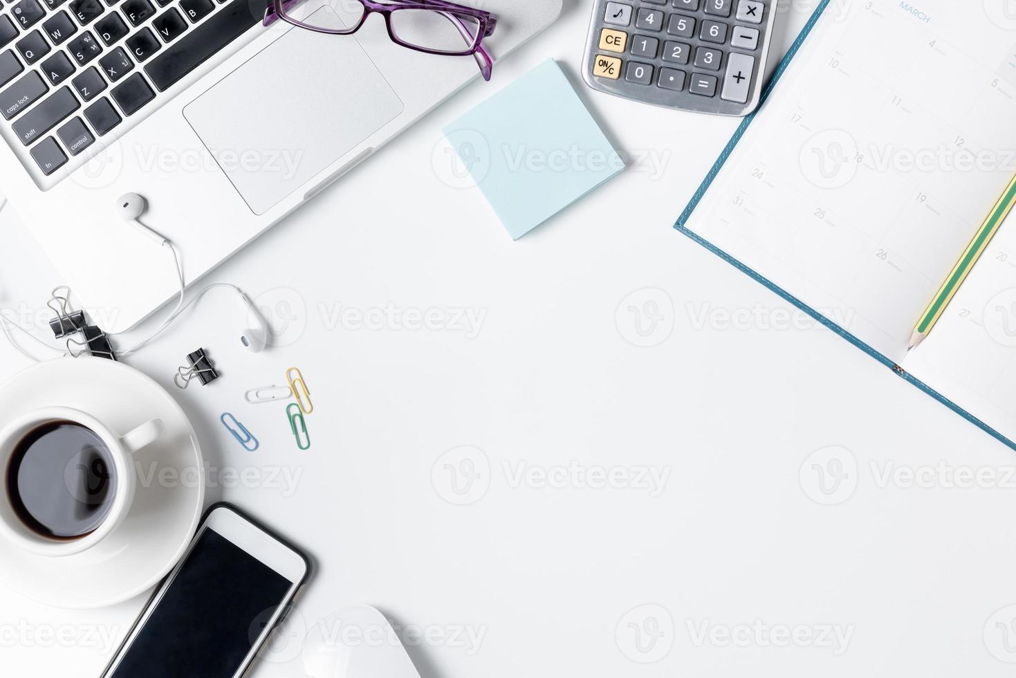 Modern white office desk table with laptop photo
