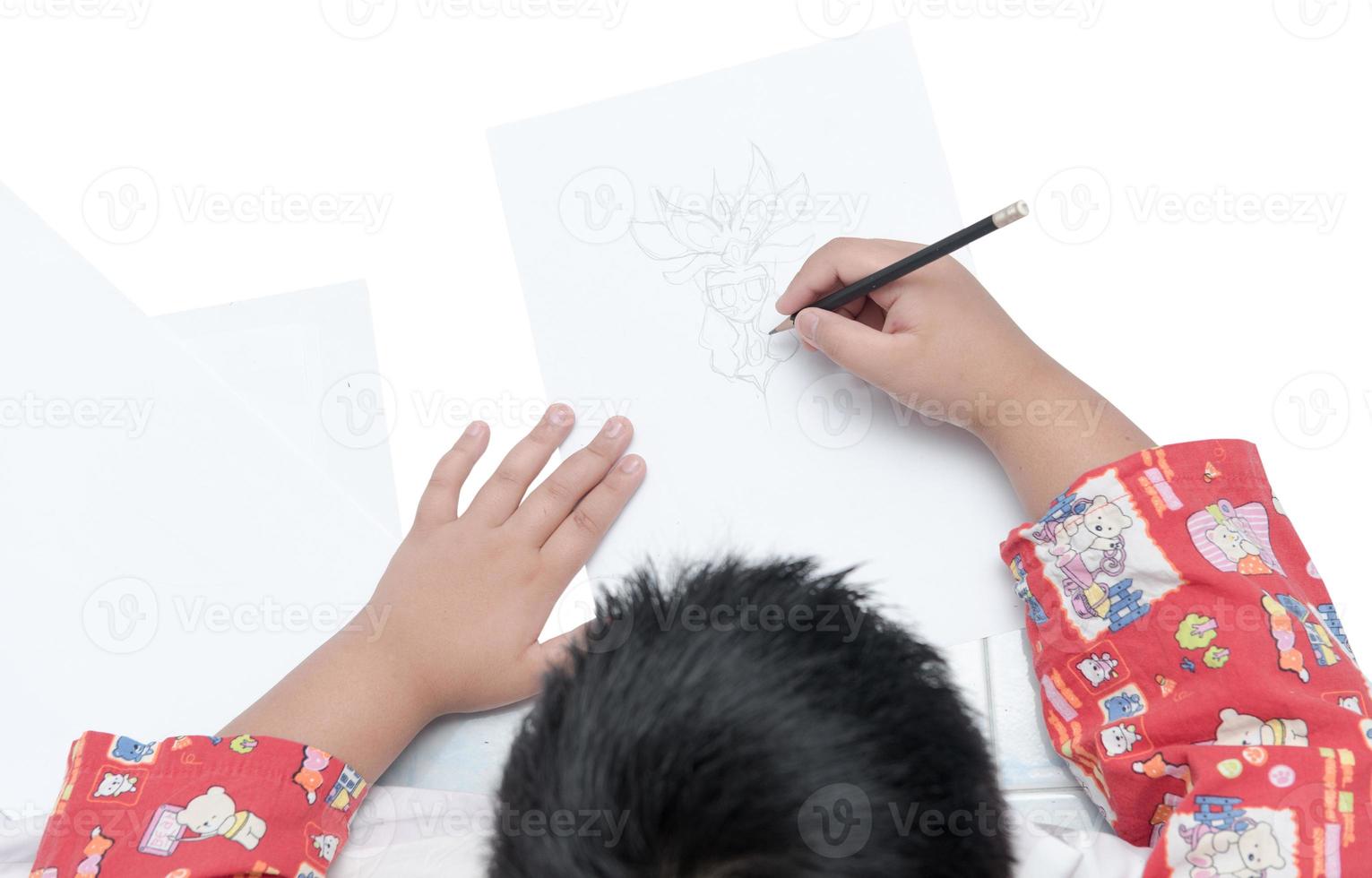 boy drawing cartoon on white paper isolated photo