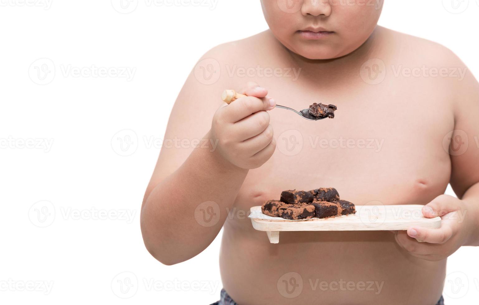 obese fat boy eat nama chocolate isolated on white photo