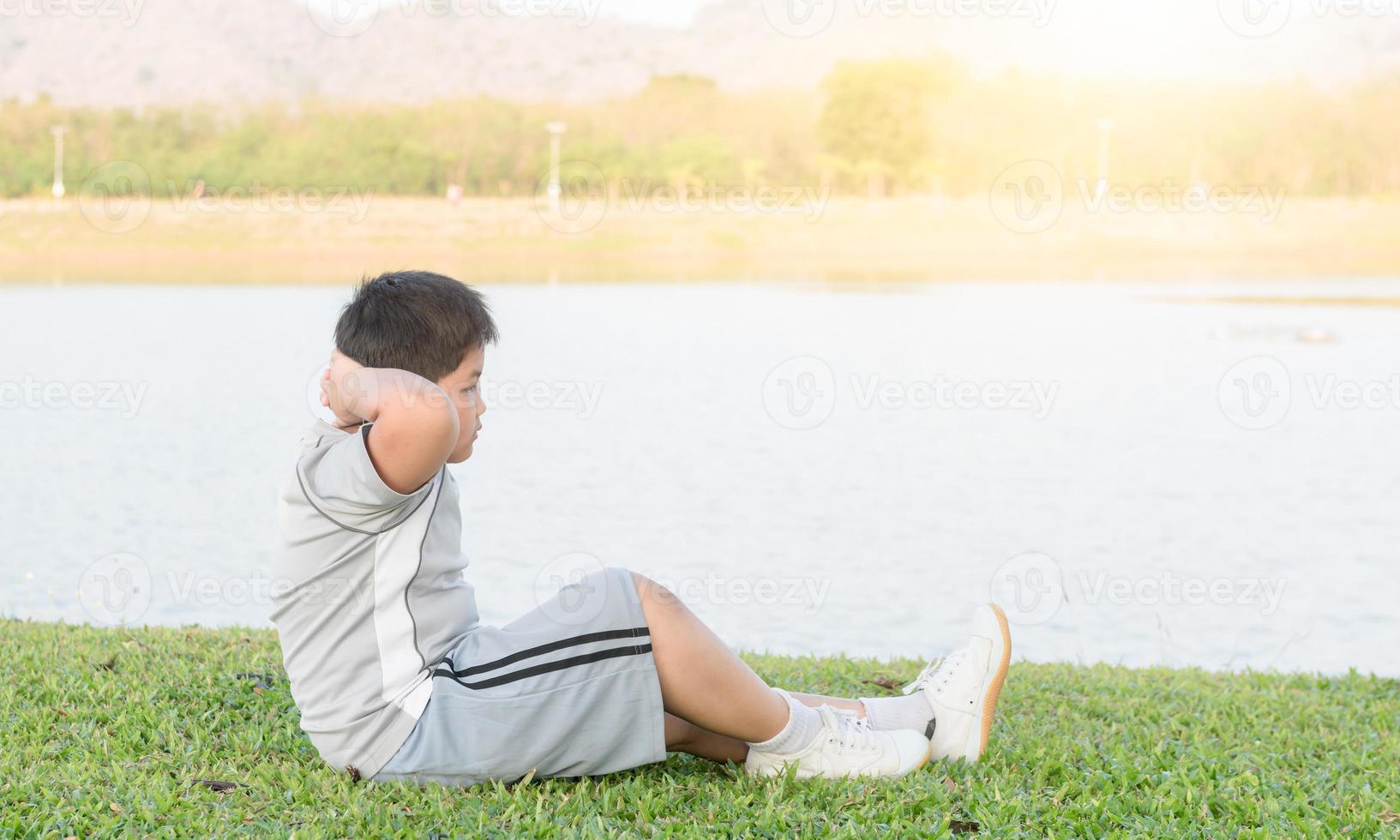 obese fat boy exercise to lose weight. photo