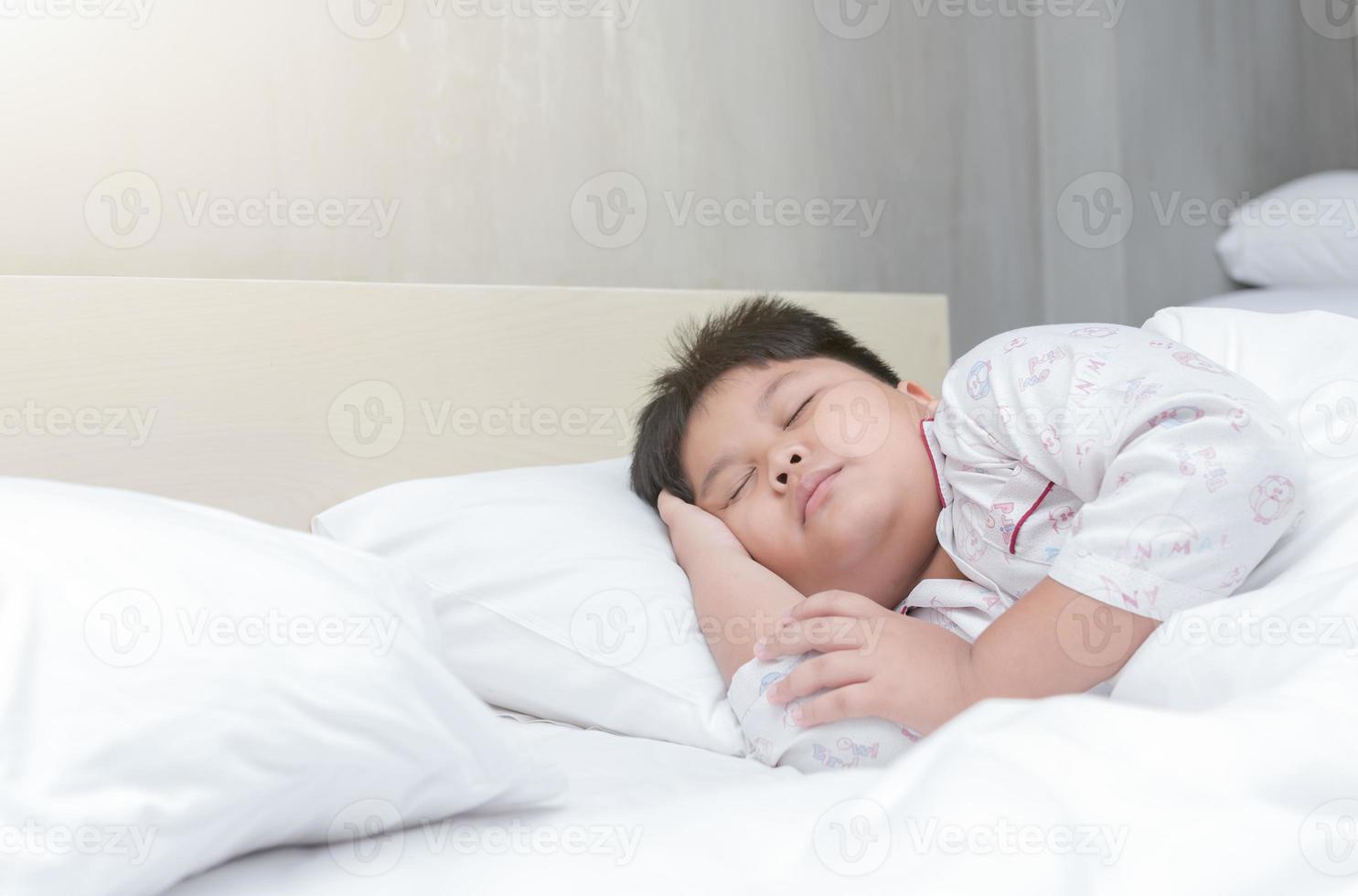 fart boy sleep on bed in bedroom photo
