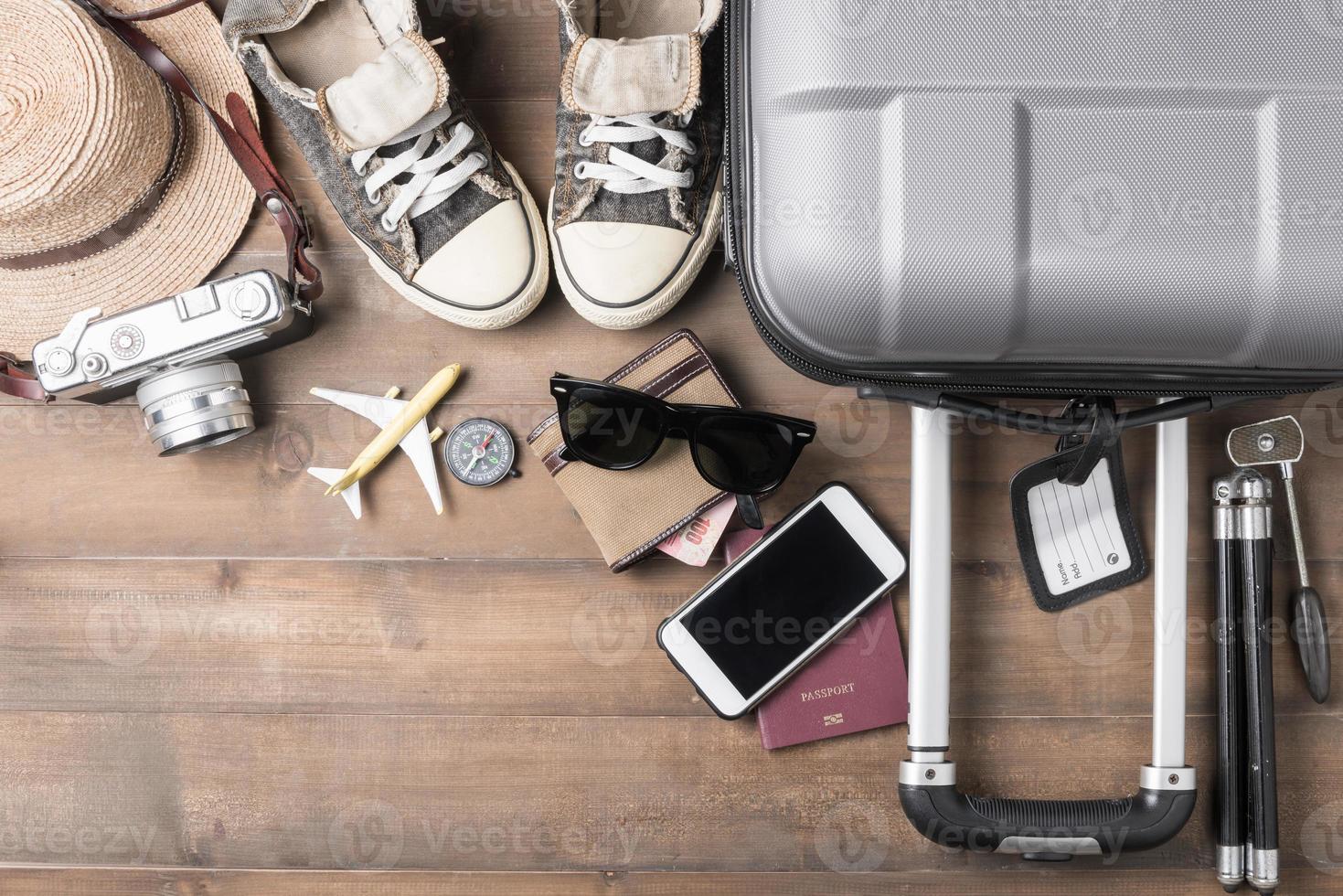 Travel accessories costumes. Passports, luggage, camera, sunglasses, sneaker photo