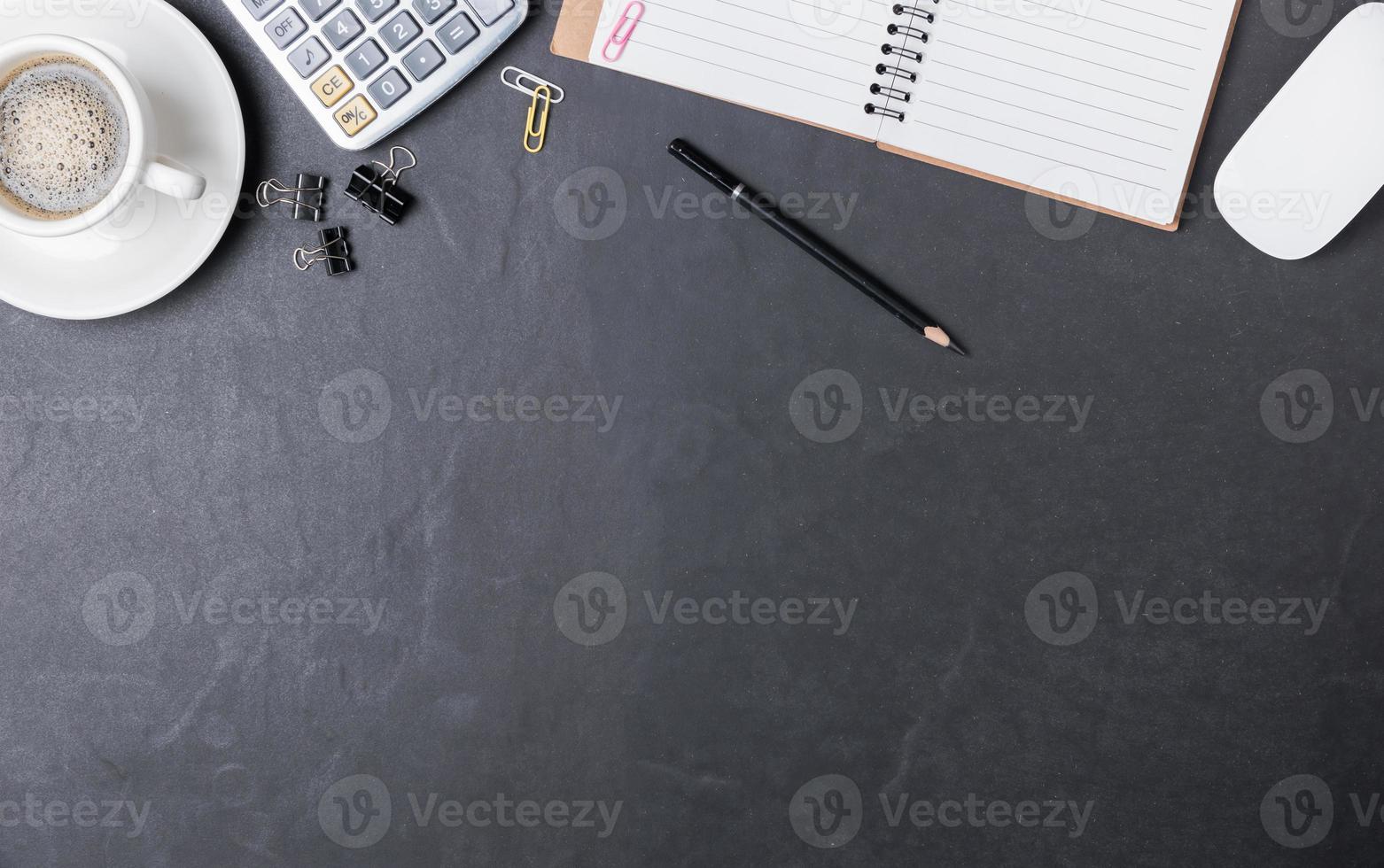 Office black desk table with calculator, paper note photo