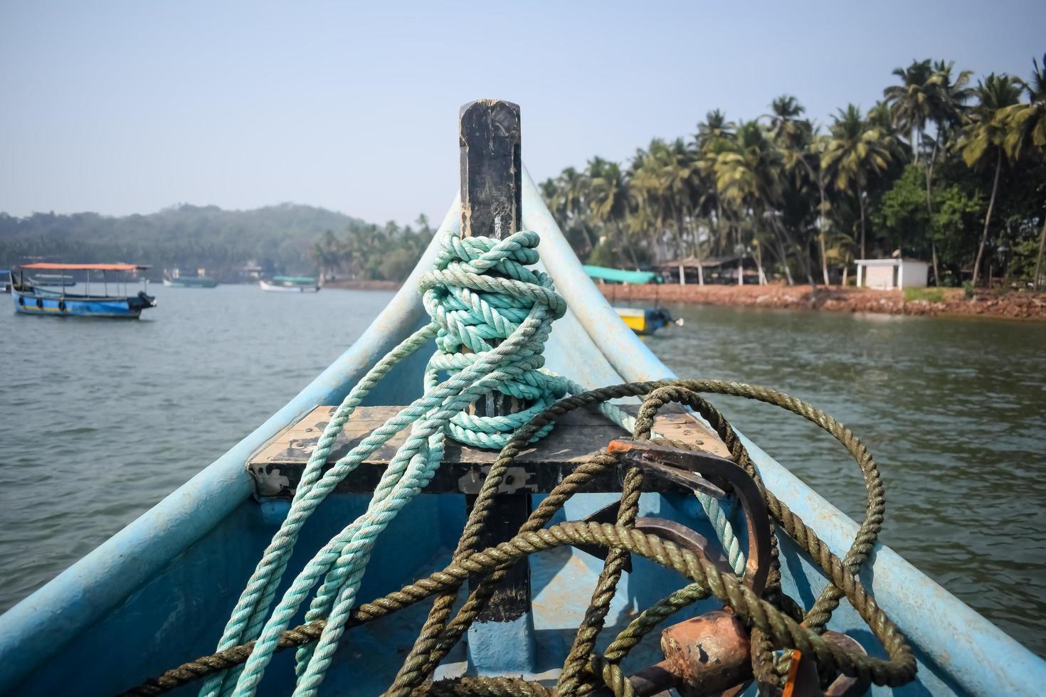 Amazing view from over long tail motor boat in Arabian sea in Goa, India, Ocean view from wooden boat with old ropes photo