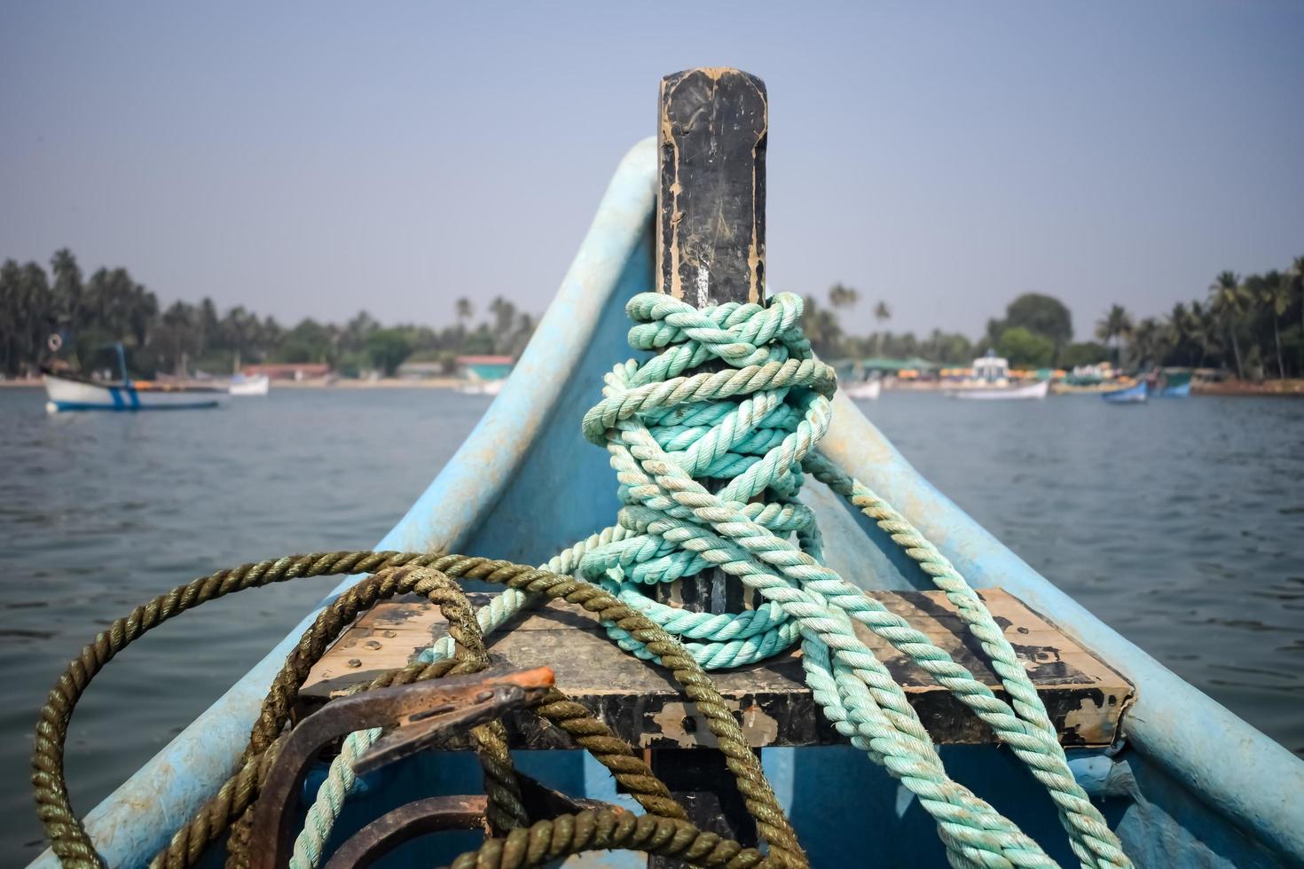 Amazing view from over long tail motor boat in Arabian sea in Goa, India, Ocean view from wooden boat with old ropes photo