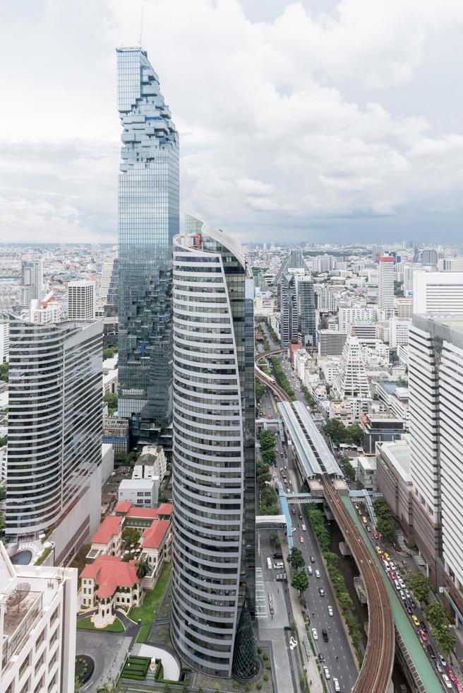 Modern style building of Mahanakhon tower with cloudy sky photo