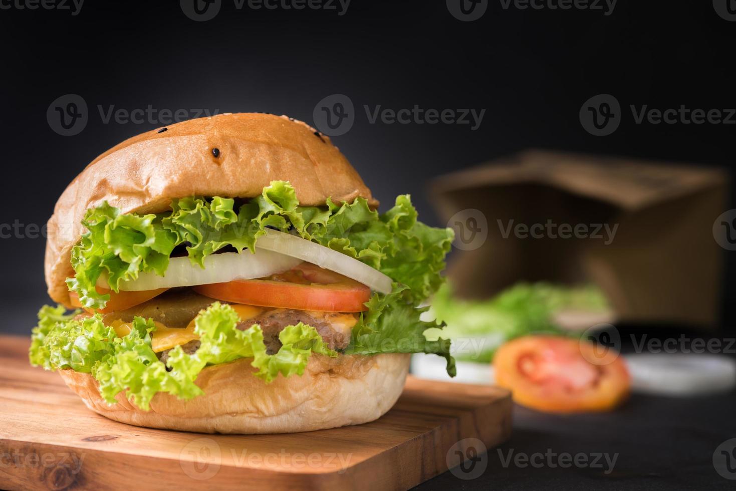 Homemade pork hamburger on black background photo