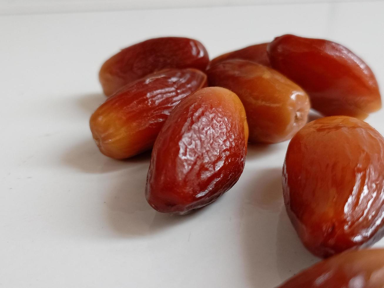 Pile of tasty dry dates isolated on white background. Arabic food