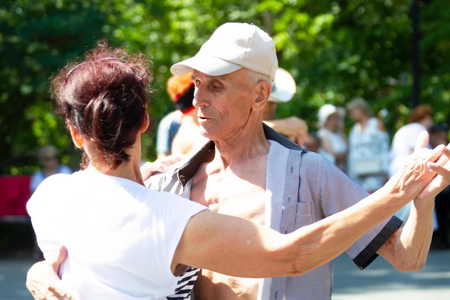 An elderly couple dancing on the dance floor. Active pensioners. photo