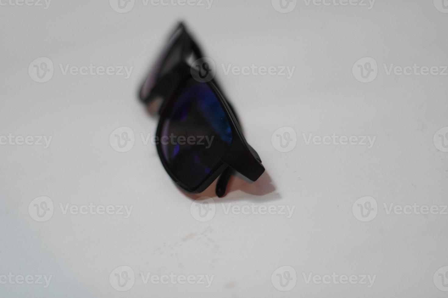 Photo of modern sunglasses with white background