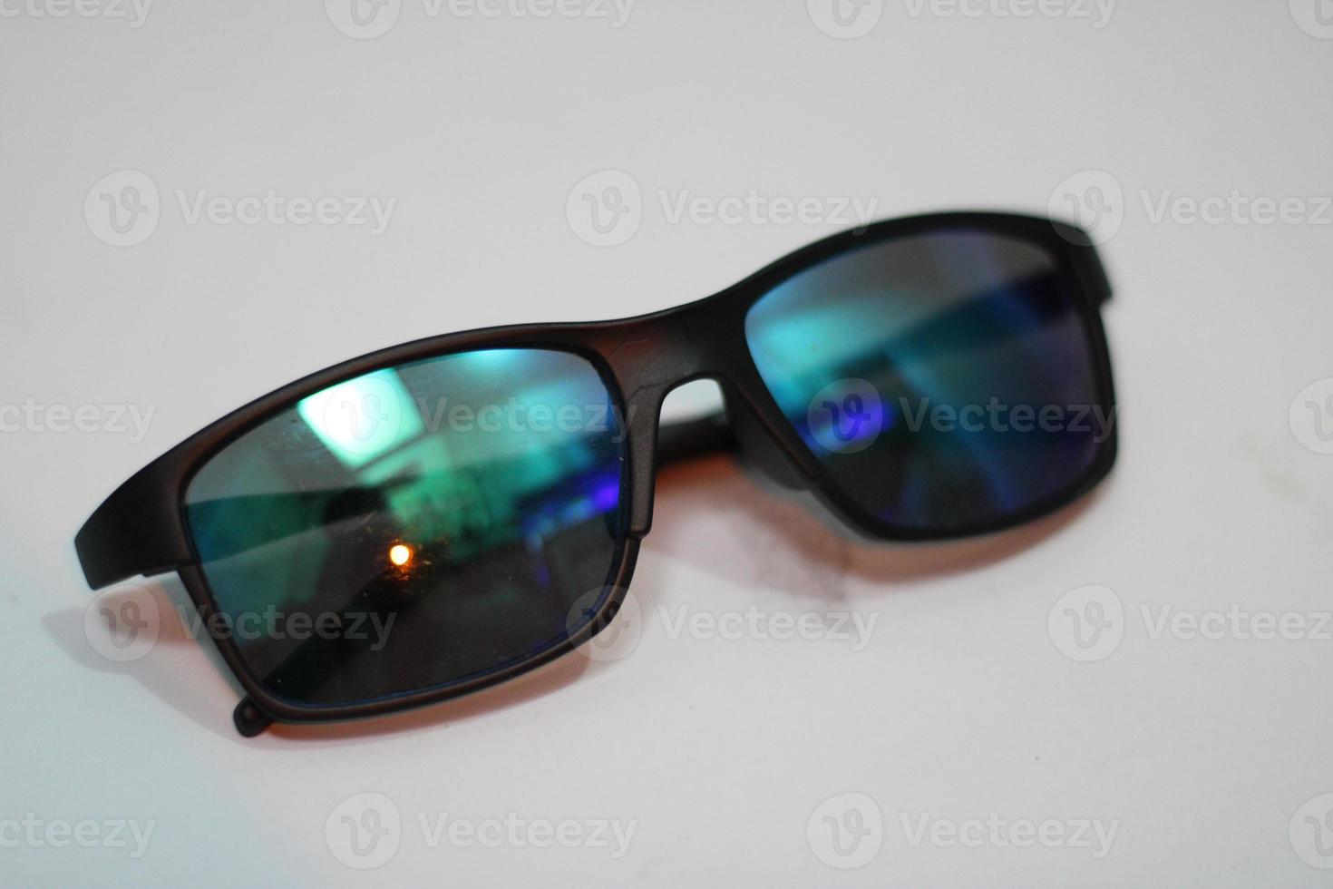 Photo of modern sunglasses with white background