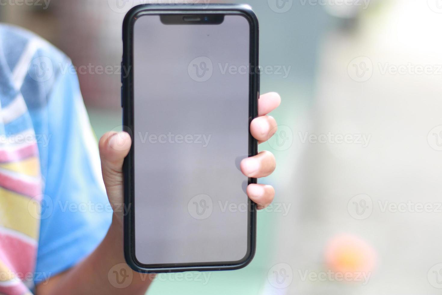 Photo of an empty cell phone held in hand