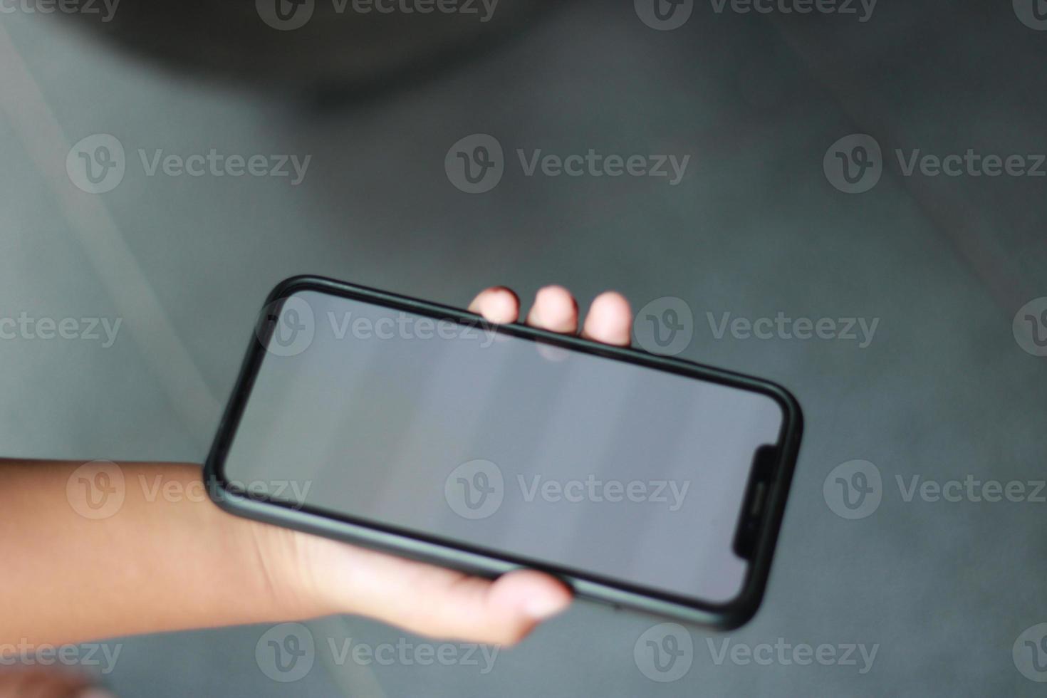 Photo of an empty cell phone held in hand