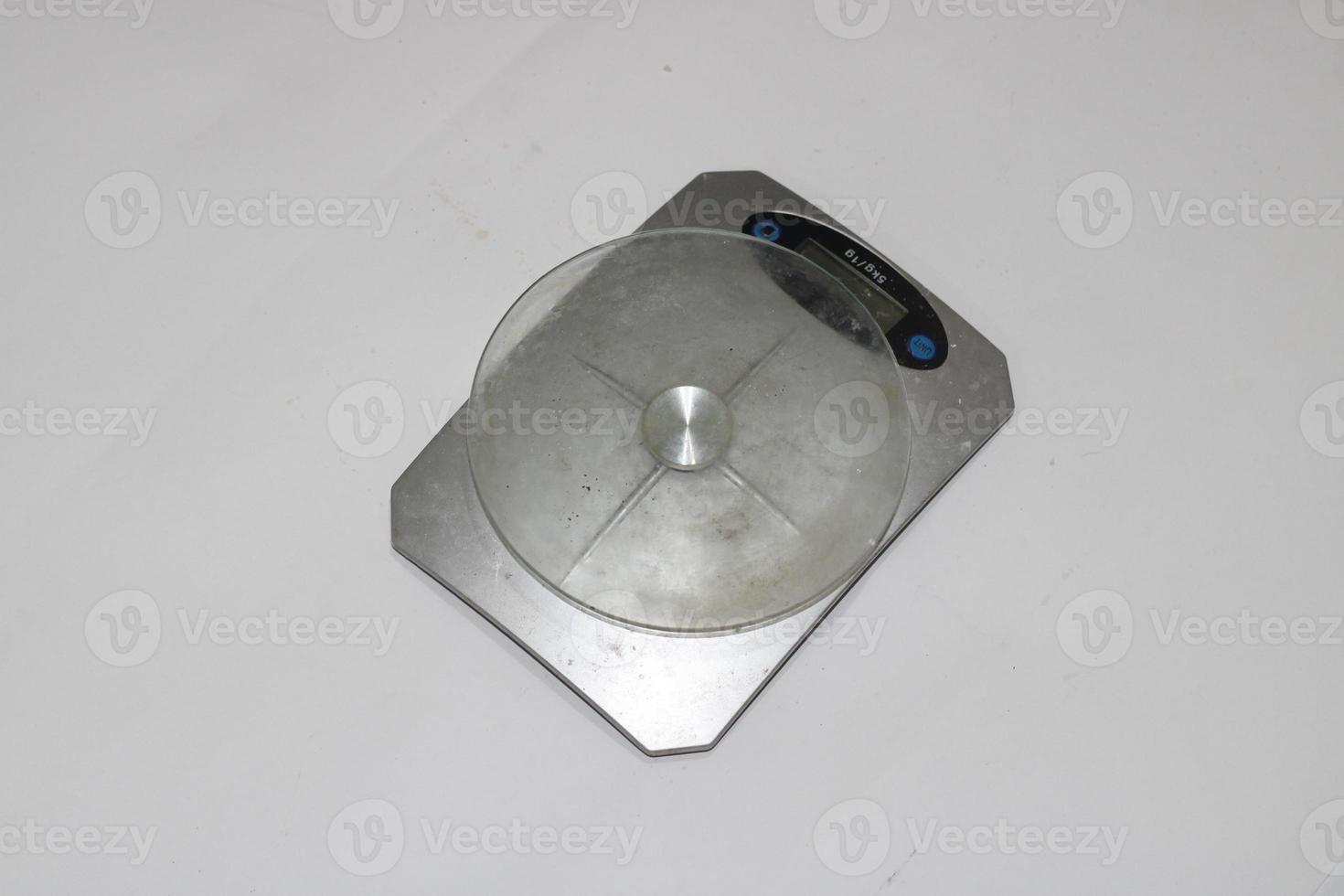 Photo of a digital scale with a white background