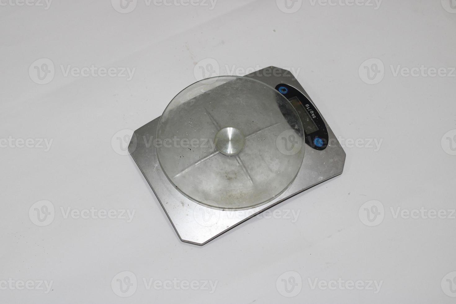 Photo of a digital scale with a white background