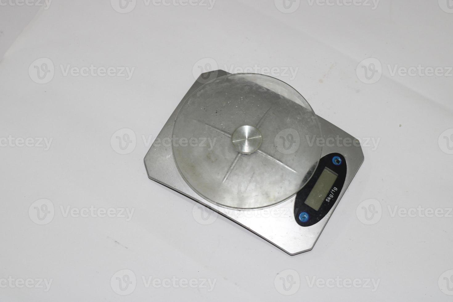 Photo of a digital scale with a white background