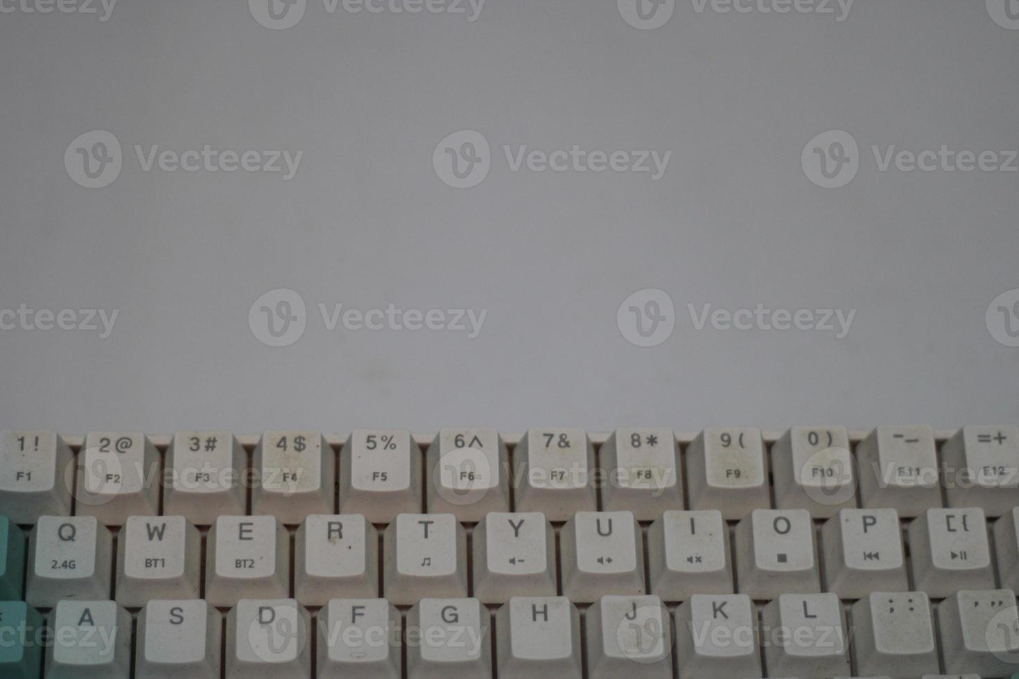 photo of a white and light blue computer keyboard