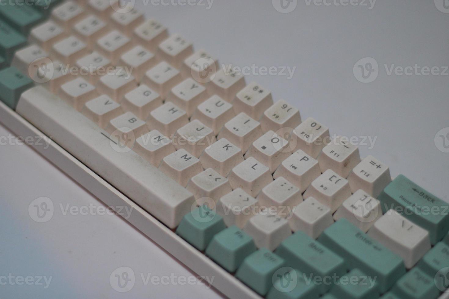 photo of a white and light blue computer keyboard