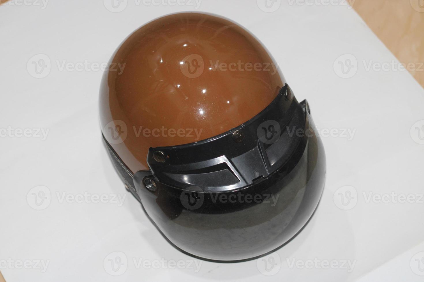 photo of brown helmet with black mirrors