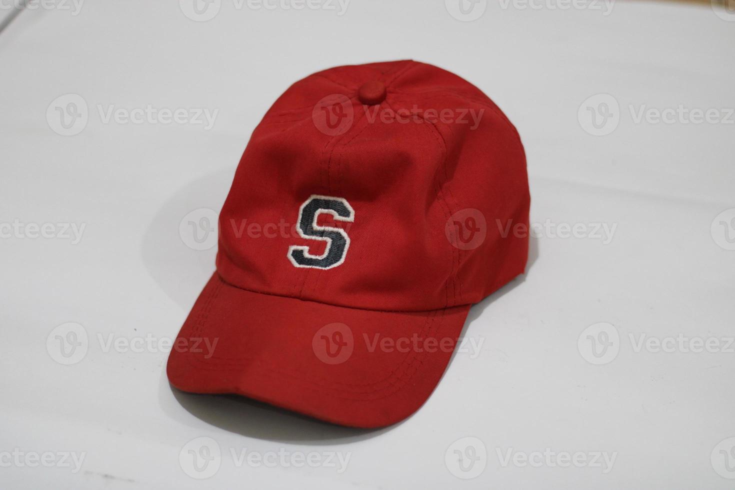 Photo of a dark red hat on a white background