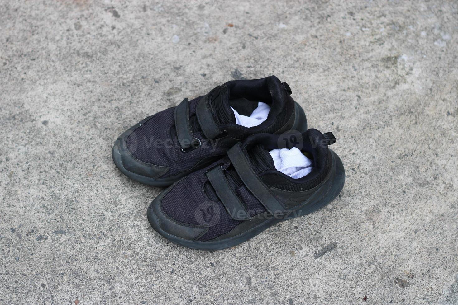 photo of black shoes worn on the street