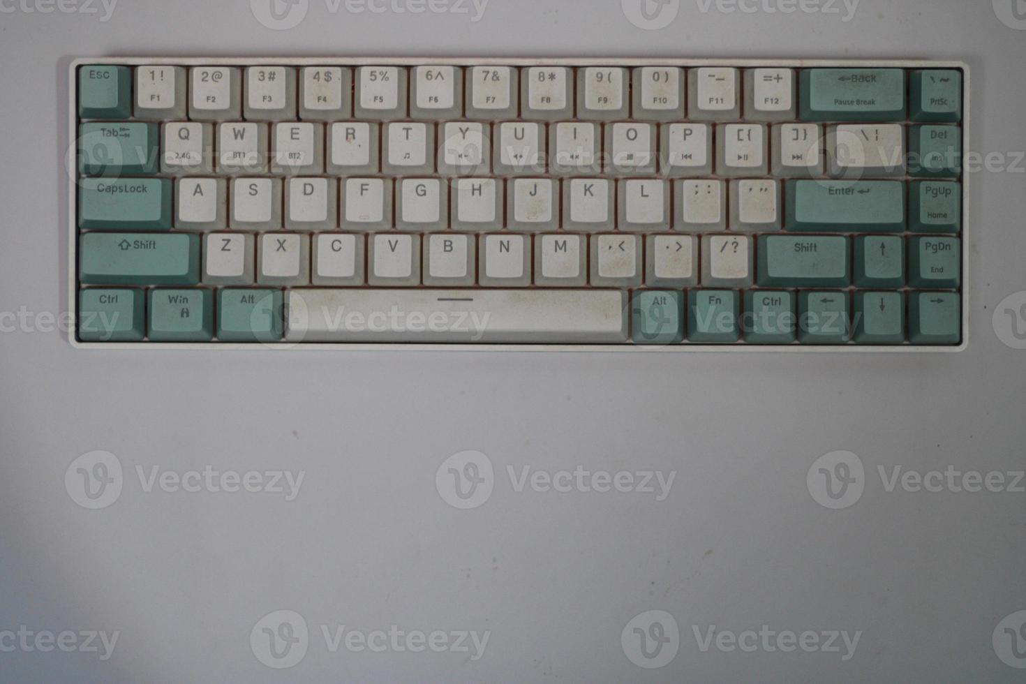 photo of a white and light blue computer keyboard