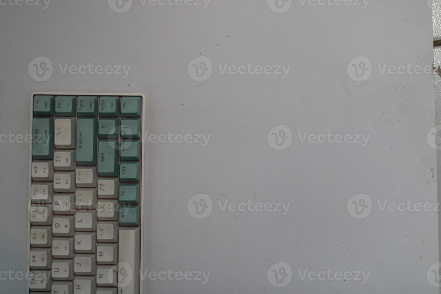 photo of a white and light blue computer keyboard